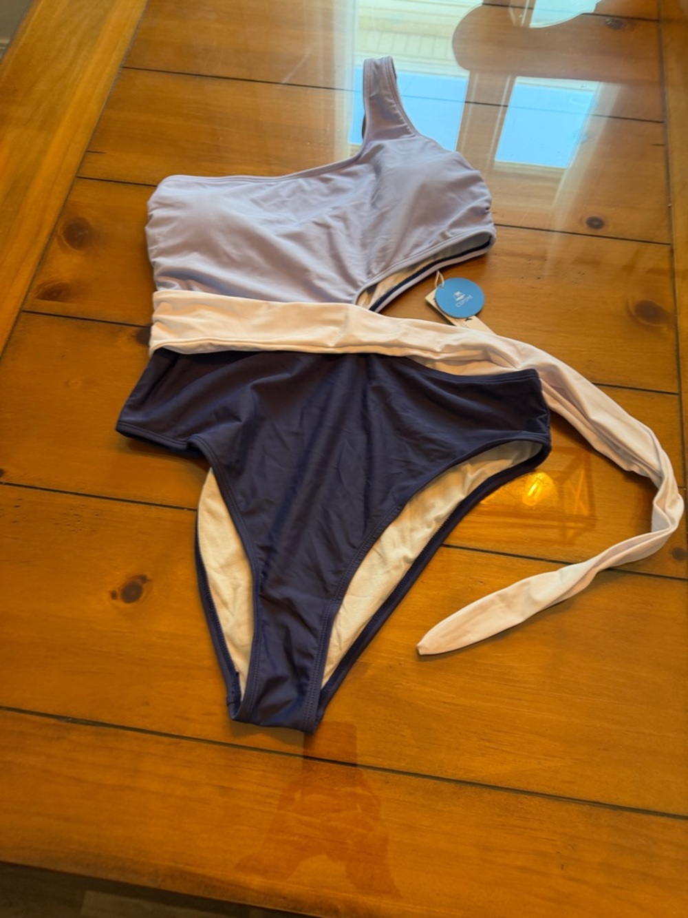 Cupshe Two-Tone One-Shoulder Swimsuit in Lavender and Navy Bottoms
